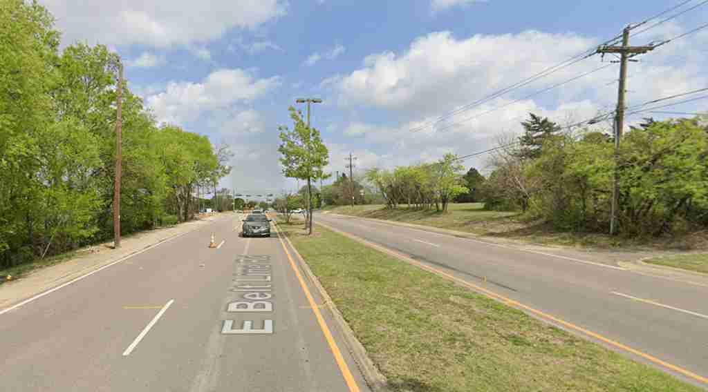 Vehicles traveling down Belt Line Road in Desoto, TX, showcasing a common urban street scene.